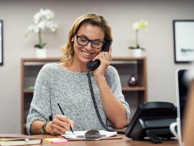 woman in office on the phone